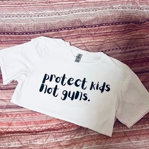 Protect Kids Not Guns short sleeve tshirt unisex The Happy Givers advocacy shirt